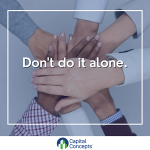image of team of people with their hands in the center of a circle with the text "Don't do it alone.: